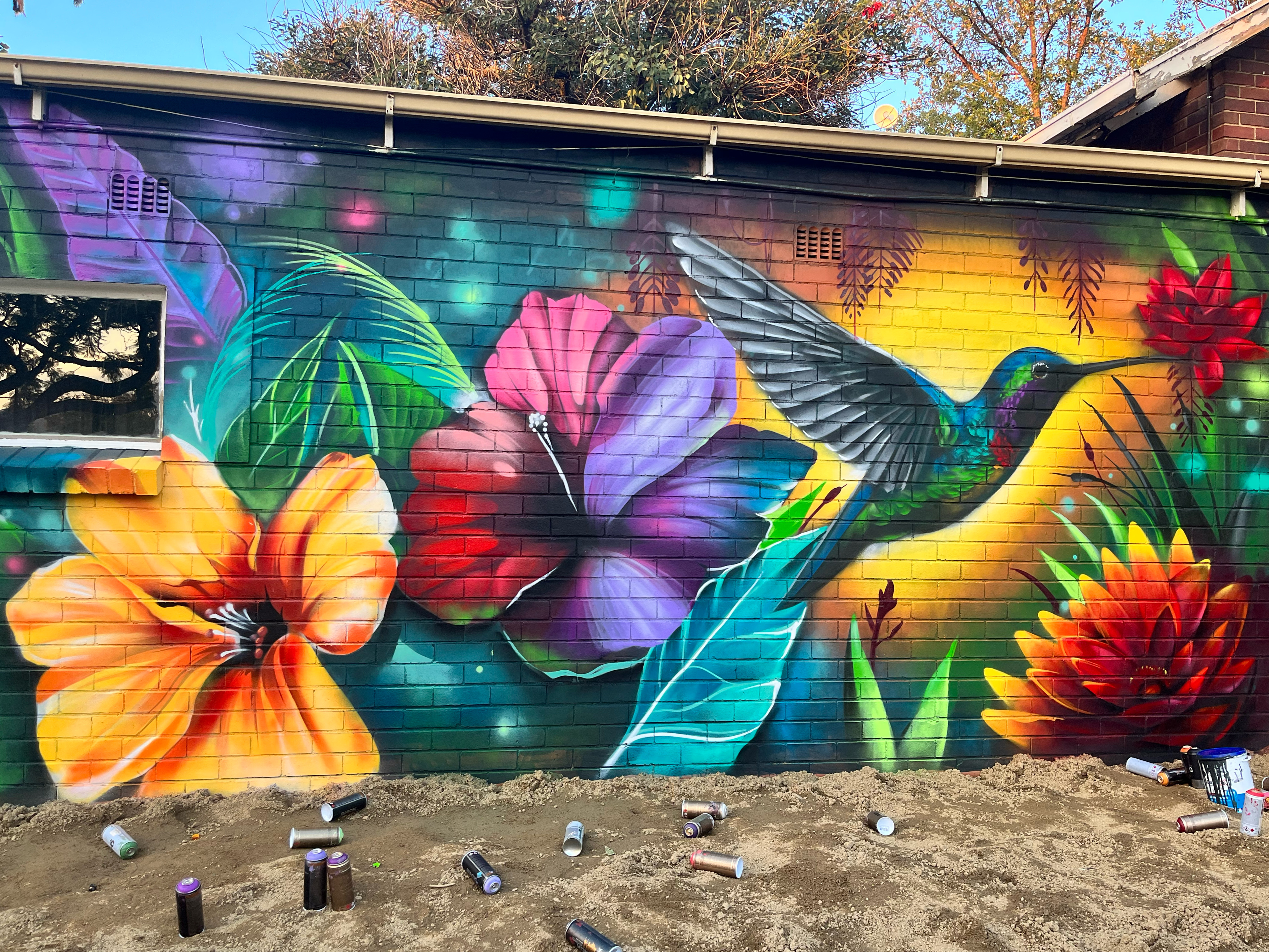 Vivid hand-painted character graffiti mural by Top Murals in London