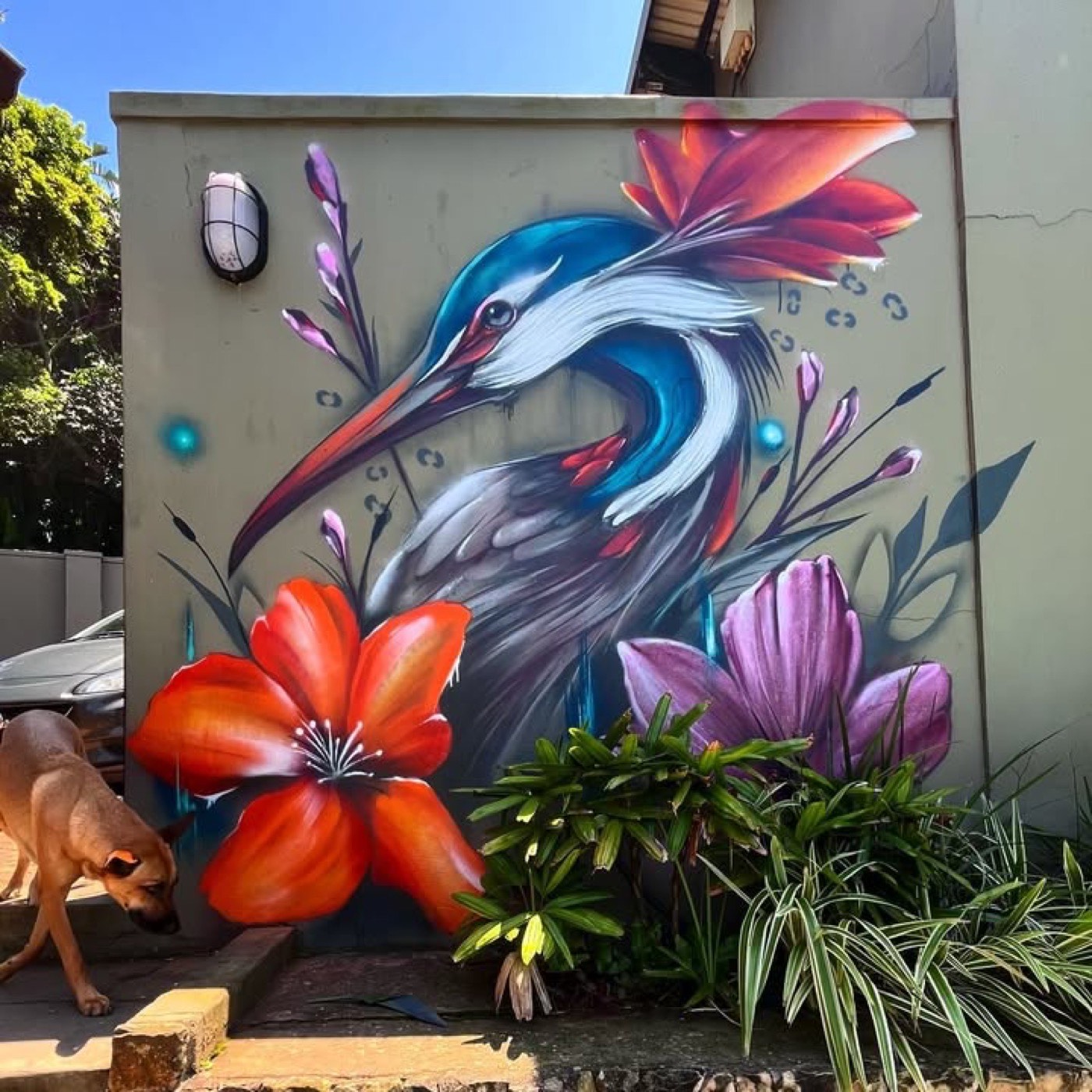 Heron and tropical flowers exterior mural by Top Murals