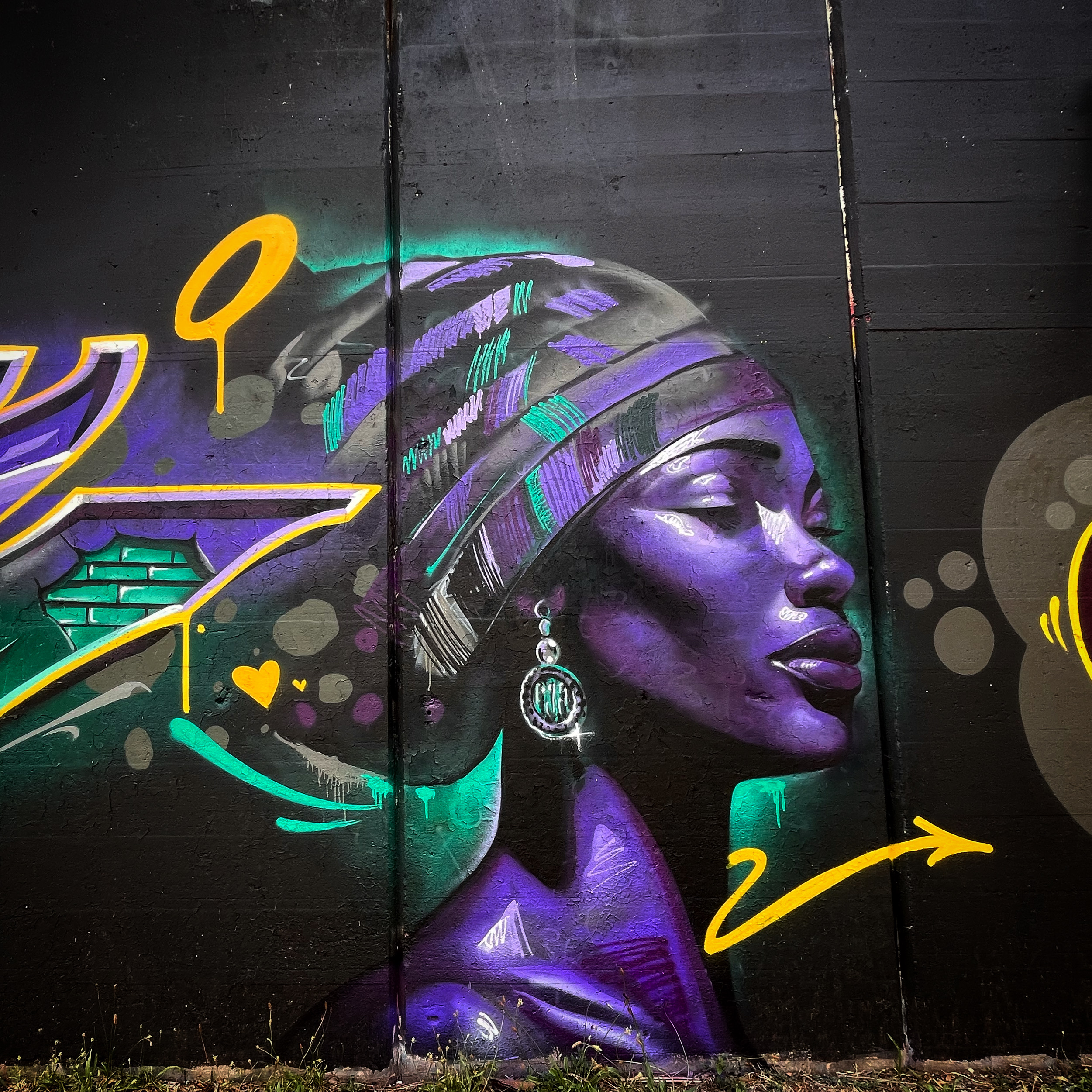 Colourful exterior wall mural by Top Murals