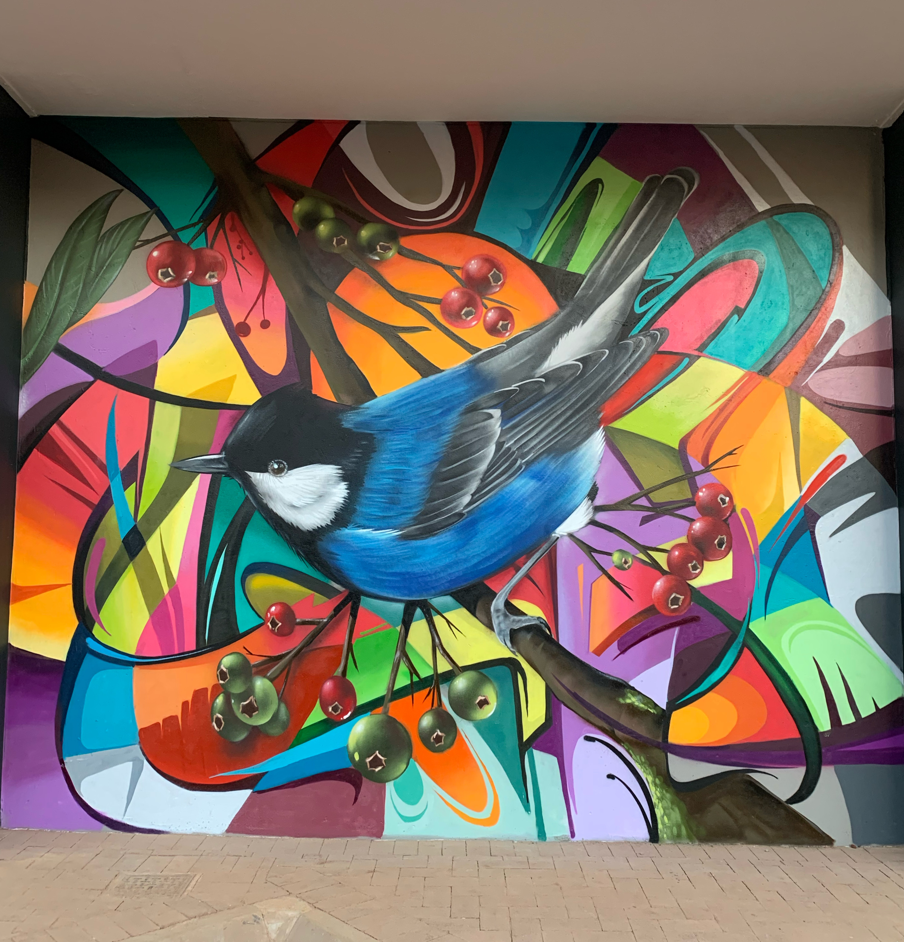 Wide-format graffiti mural with chunky bubble letters by Top Murals